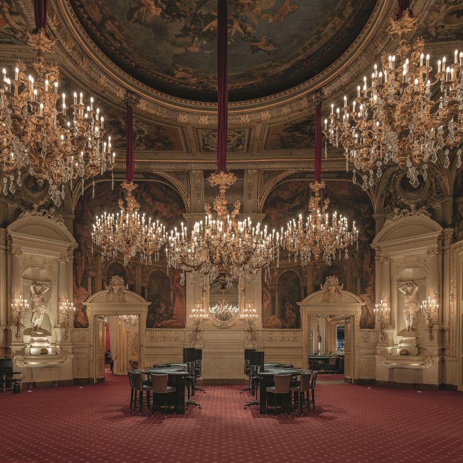 Luxurious interior with grand chandelier, opulent decor, and elegant furnishings